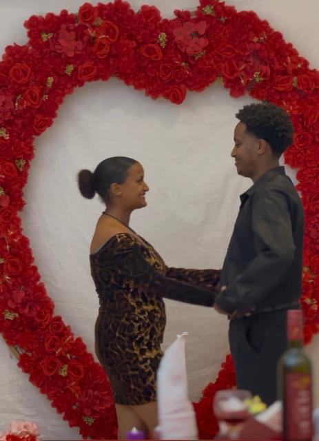 Couple portrait in a floral heart frame