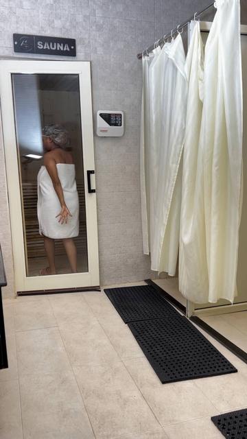 Guest entering the sauna at a spa